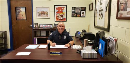 Picture of SRO Michael at his desk 